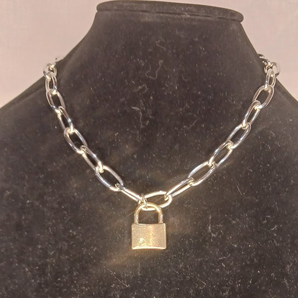 silver tone chain and gold tone lock necklace